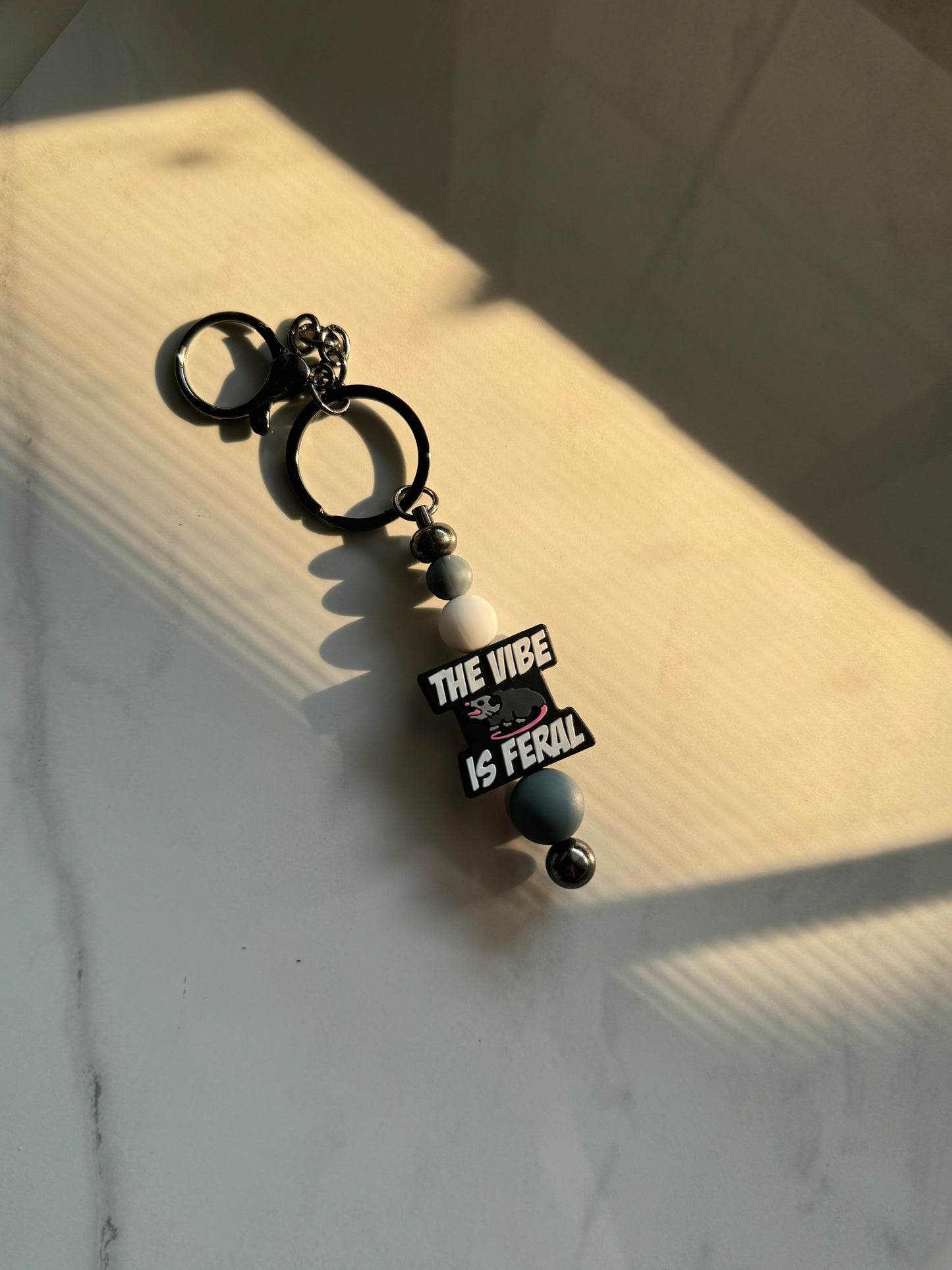 The Vibe Is Feral Silicone Keychain